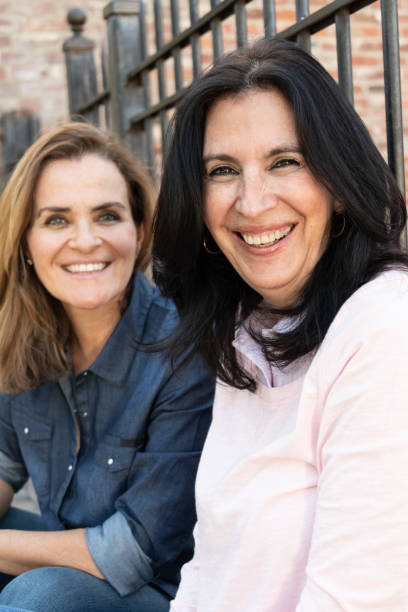 istock smiling mature women posing looking at the camera 1066385706