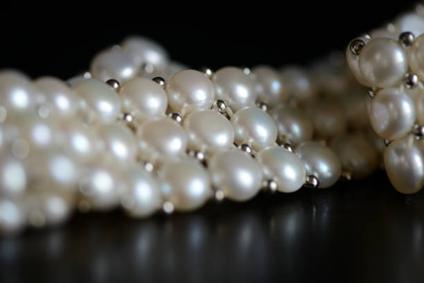 istock White pearl necklace on a dark background close up 1066415250