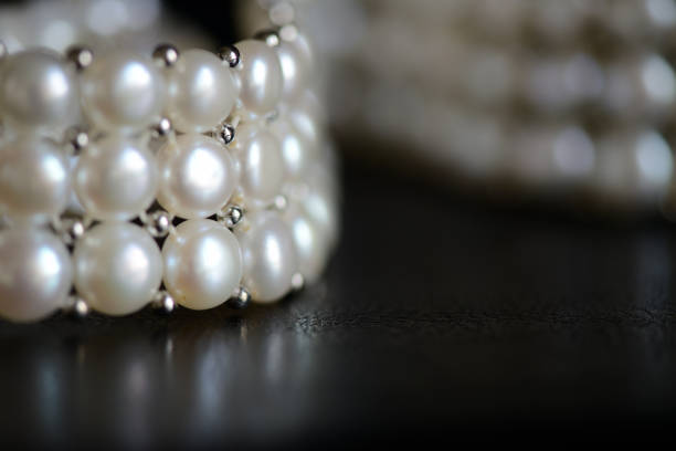 istock White pearl necklace on a dark background close up 1066415252