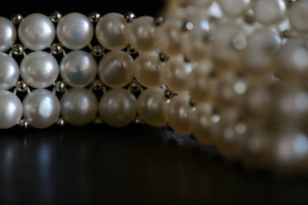 istock White pearl necklace on a dark background close up 1066415254