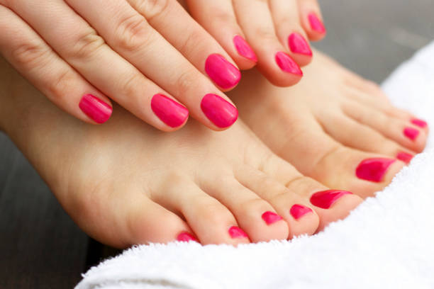 Red manicure and pedicure Red manicure and pedicure manicure stock pictures, royalty-free photos & images