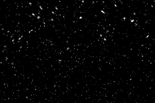 Nieve que cae sobre fondo negro. Fondo de invierno en pura oscuridad. Nevadas. photo