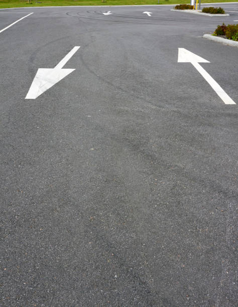 istock lane arrows on tarmac 1066447694