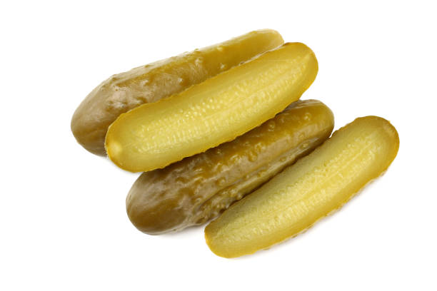 istock sliced marinated pickled cucumbers isolated on white background. top view 1066451786