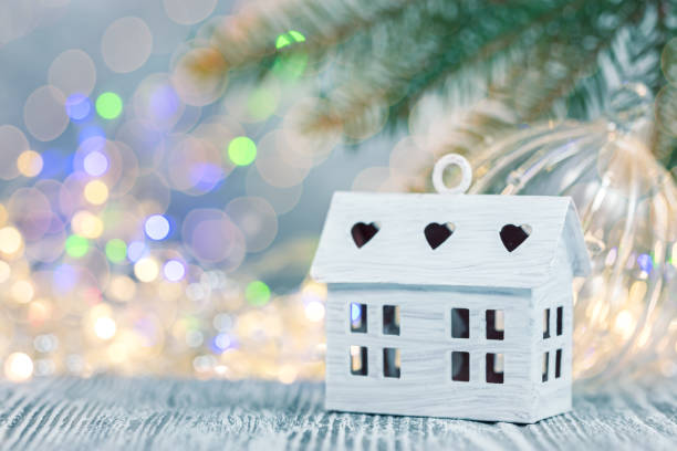 istock christmas decorations on defocused winter background with lights and fir tree branch 1066453456