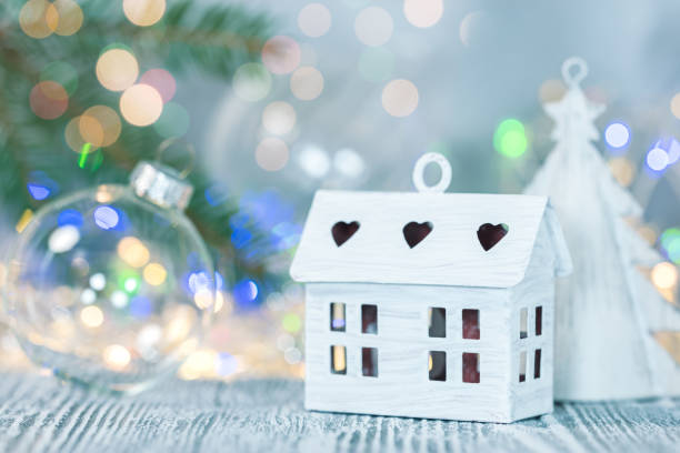 istock christmas decorations against blurred glowing light garlands background 1066453884