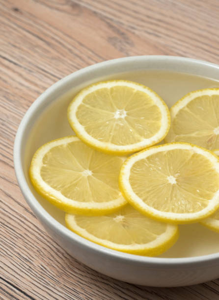 istock Lemon slices in a bowl with water. Close up view. 1066455980