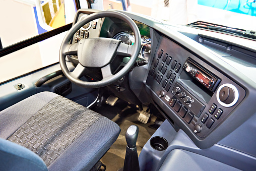 Driver seat and steering wheel with the dashboard of the bus
