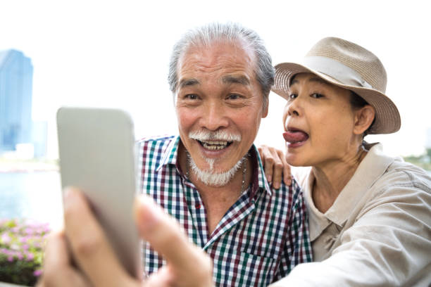 istock Thai senior couple take a selfie on vacation 1066464288