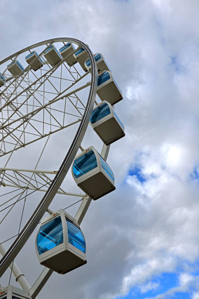 istock Ferris wheel on background of cloudy sky (fragment) 1066472394