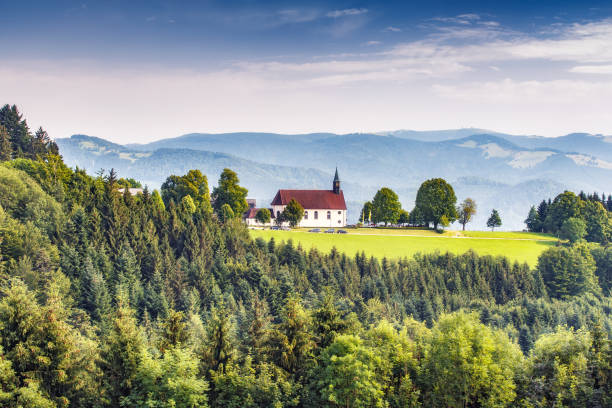 Scenic mountain landscape with an old church in the Black Forest, Germany. Scenic mountain landscape with an old church in the Black Forest, Germany. Colorful travel background. black forest photos stock pictures, royalty-free photos & images