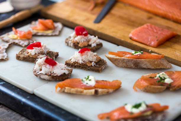 istock Freshly Prepared Smoked Salmon and Crab Canapes on Crusty Bread 1066475738