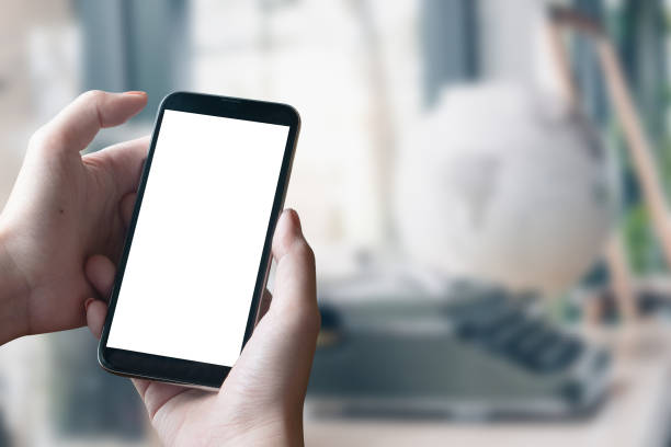 istock Mockup smartphone blank screen in woman hands over blurred background. 1066475852