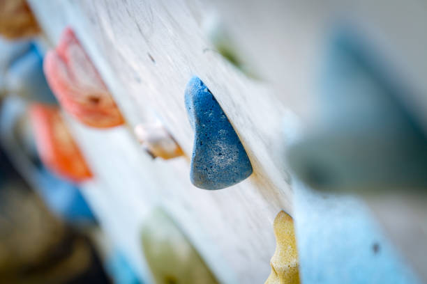 Teenage Boy Training Climbing On Indoor Climbing Wall stock photo