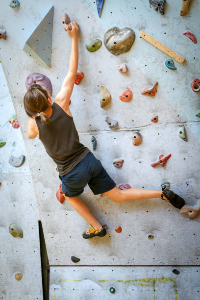 istock Teenage Boy Training Climbing On Indoor Climbing Wall 1066482216