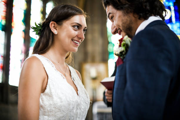 istock Happy bride and groom at the altar 1066483762