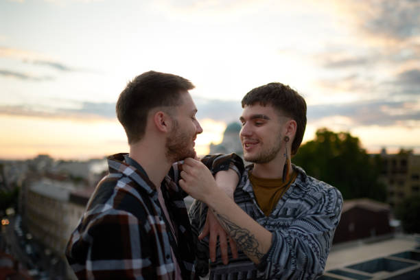 istock Gay couple on a rooftop 1066484580