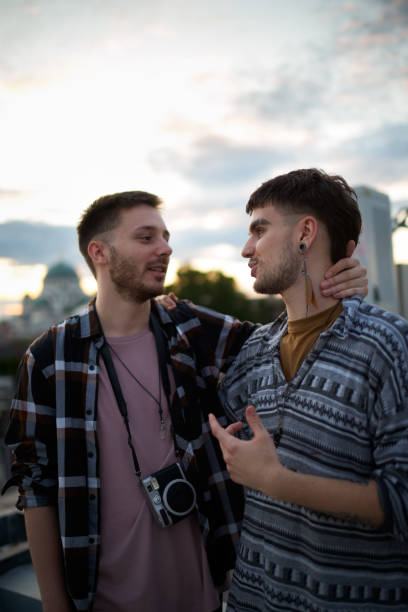 istock Gay couple hugging on a rooftop 1066484706