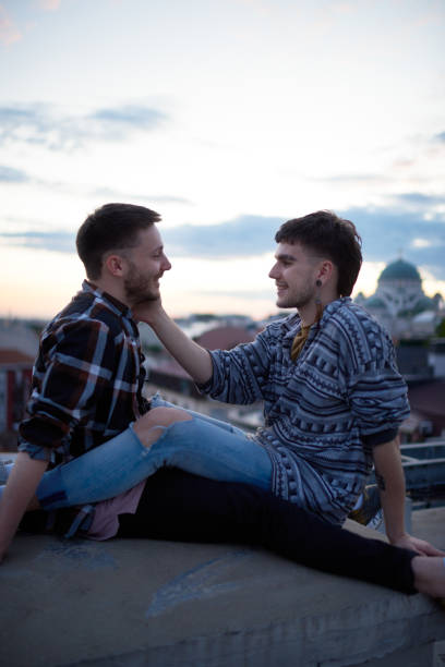 istock Gay couple sitting on a rooftop 1066484760