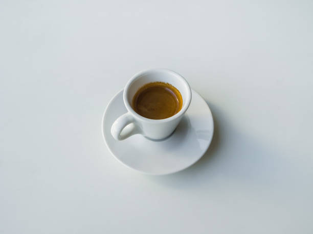 istock A Cup of strong black coffee on a white table. 1066484940