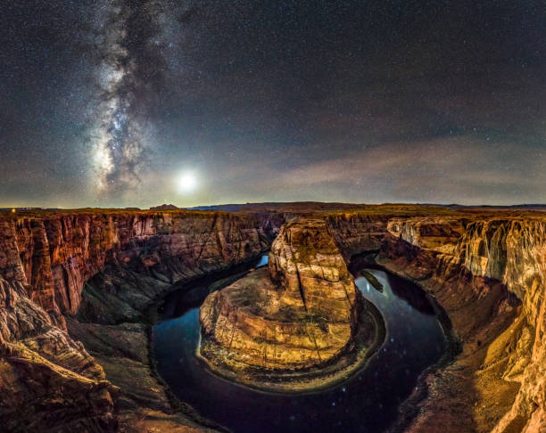 big panorama of Horseshoe Bend at night with Milky way and moon. Arizona candid photo of Horseshoe Bend at night with milky way and moon in the sky. Arizona. USA horseshoe bend river stock pictures, royalty-free photos & images