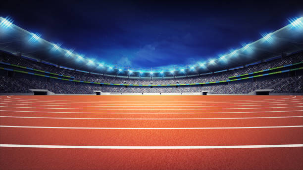 istock athletics stadium with track at panorama night view 1066490174