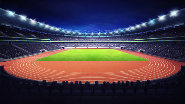 athletics stadium with track and grass field at front night view - sports track track and field stadium sport night imagens e fotografias de stock