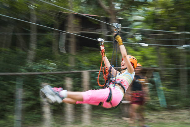 zip-futter in bewegungsunschärfe! - zip lining stock-fotos und bilder