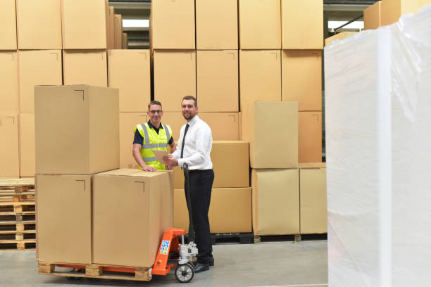istock Worker and Manager in a warehouse in the logistics sector - transport and processing of orders in trade 1066494272