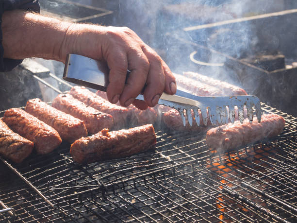 istock Cooking BBQ meat. Picnic in nature with cooking meat. 1066497256