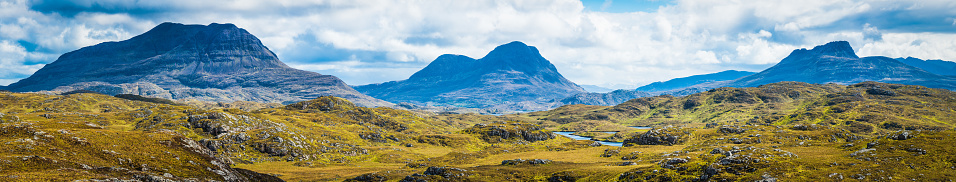 Panoramic vista across the Inverpolly Forest mountain wilderness in Wester Ross to the iconic peaks of Cul Mor, Cul Beag and Coigach, Highlands, Scotland.