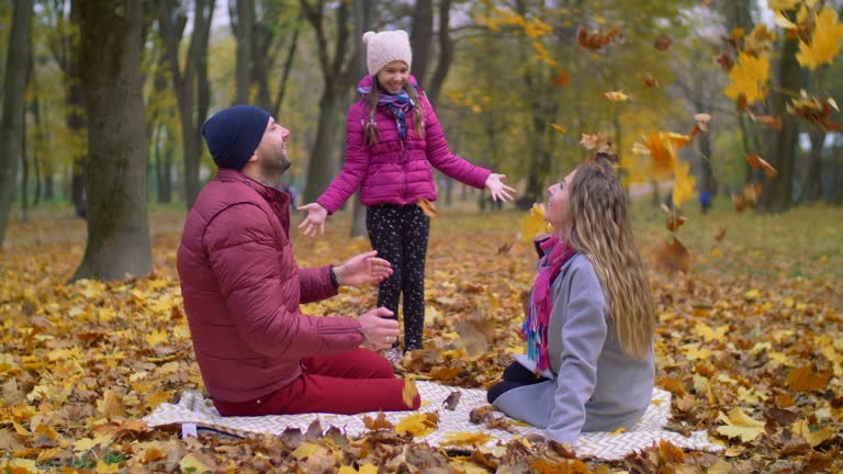 Family enjoying beautiful autumn day in nature