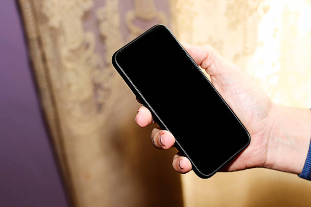 istock Top view of man holding smart phone 1066502076