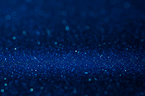 Abstract dark vivid navy blue sparkling glitter wall and floor perspective background studio with blur bokeh.luxury holiday backdrop mock up for display of product.holiday festive greeting card