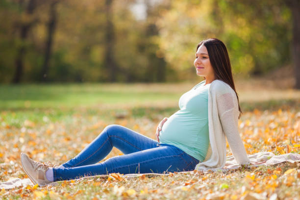 istock Pregnant woman in park 1066510162