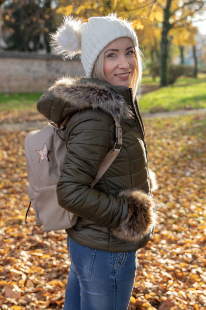 istock Woman walking in park on sunny autumn day 1066510834
