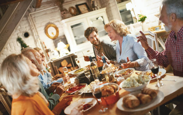 istock Family having Thanksgiving dinner. 1066511140
