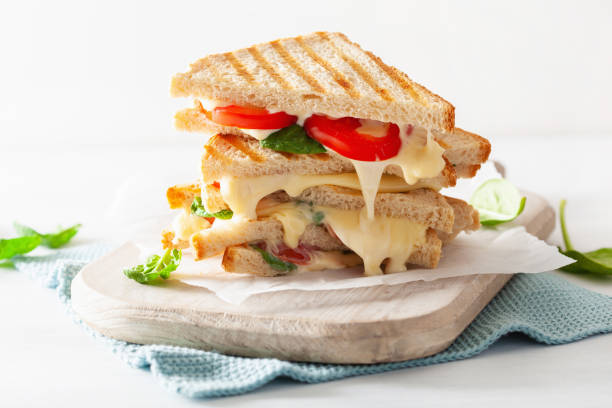 istock grilled cheese and tomato sandwich on white background 1066515508