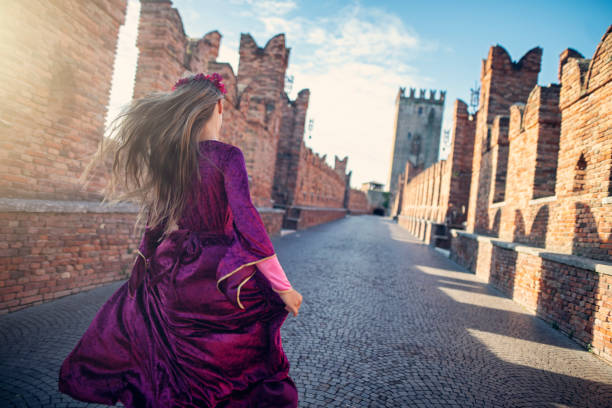 Little Juliet Capulet running on Verona bridge. \nNikon D850.