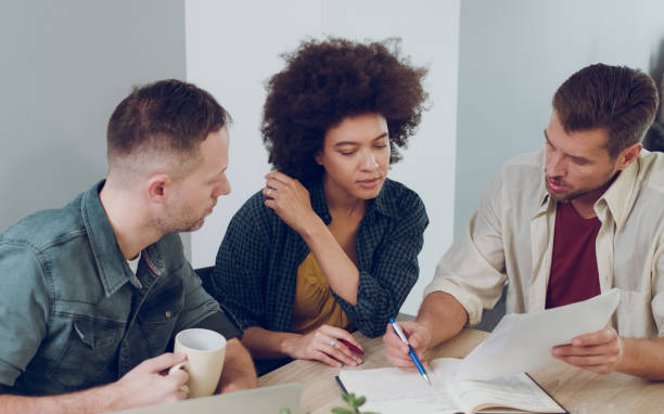 istock Multi-ethnic business people working in office together 1066520960