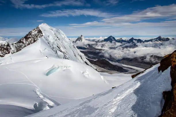 Panoramic view of a snow and ice covered mountain on a alpine tour called Spaghettirunde in the Alps, Monte Rosa Massif, Italy
