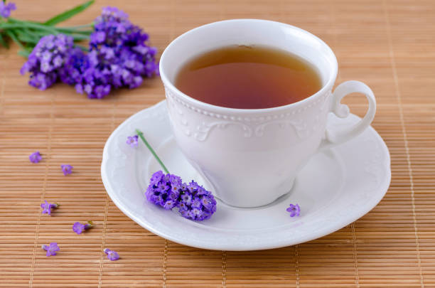 istock cup of healing tea with fresh lavender flowers, selective focus 1066523548