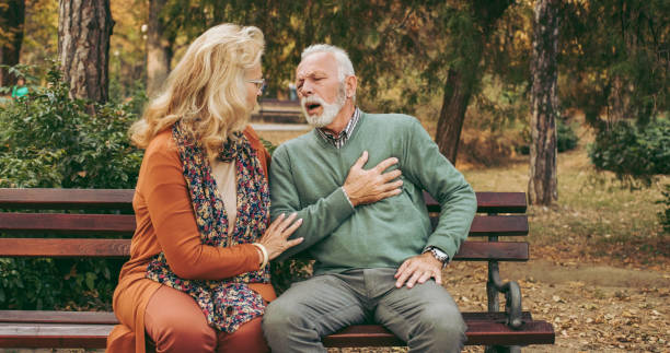 istock Elderly man having chest pains or heart attack in the park 1066524168