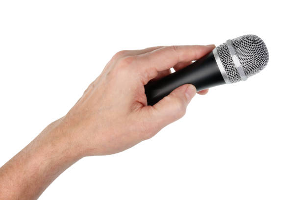 istock Elderly male singer holds silver  vocal dinamic  microphone in his hand 1066533388