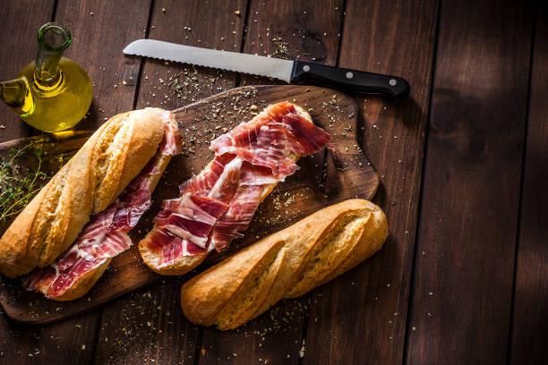 istock Preparing iberico ham sandwich, Spanish sandwich of iberian ham 1066536252