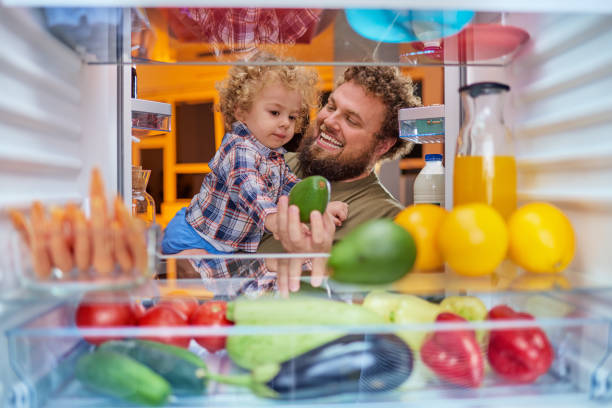istock Father and son  looking something to eat at night. 1066536688