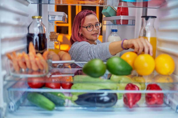 istock Thick woman taking food from fridge. 1066536782