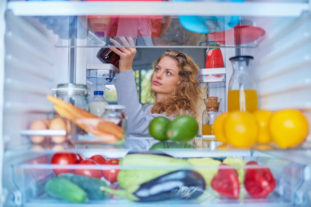 istock Woman taking food from fridge. 1066537928