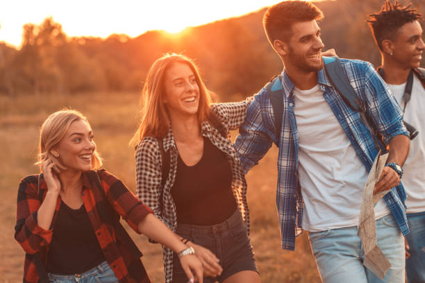 istock Group of four friends hiking through countryside. 1066538908