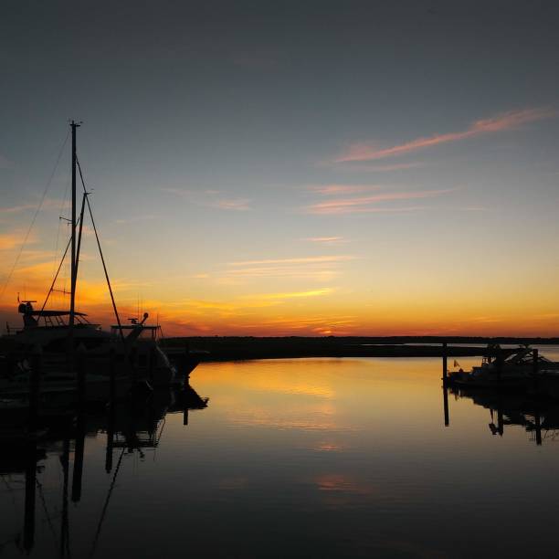 istock Sunset sky on a calm waterway 1066538966